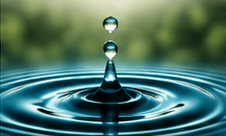 A water droplet falling into still water